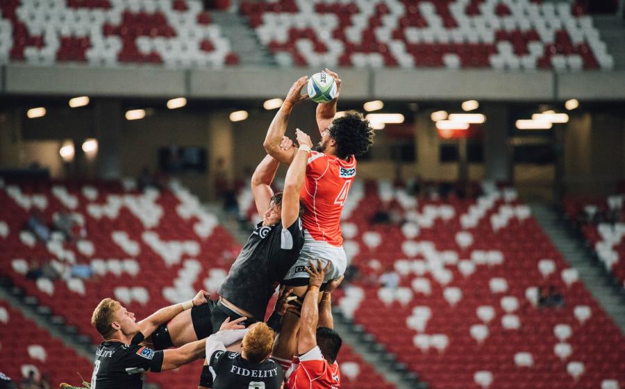 Rugby players jumping for ball at lineout